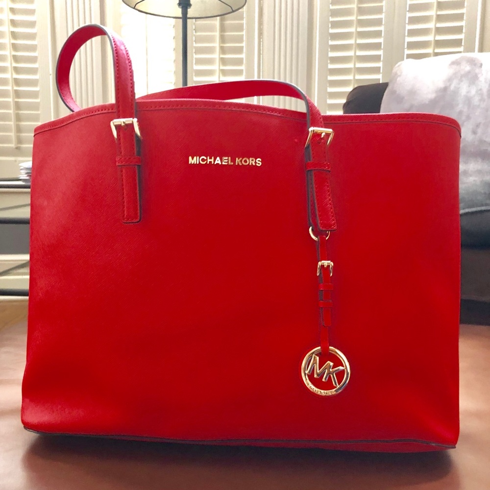 New  MK travel tote with center zip compartment.